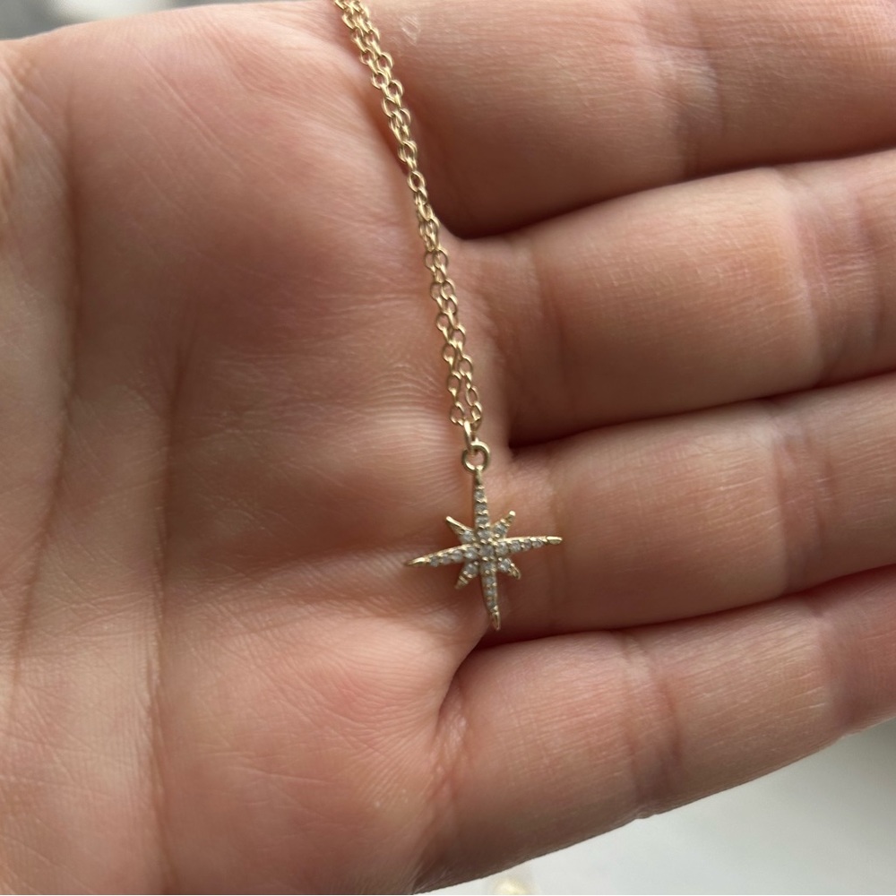 Star shaped gold necklace with crystal detail